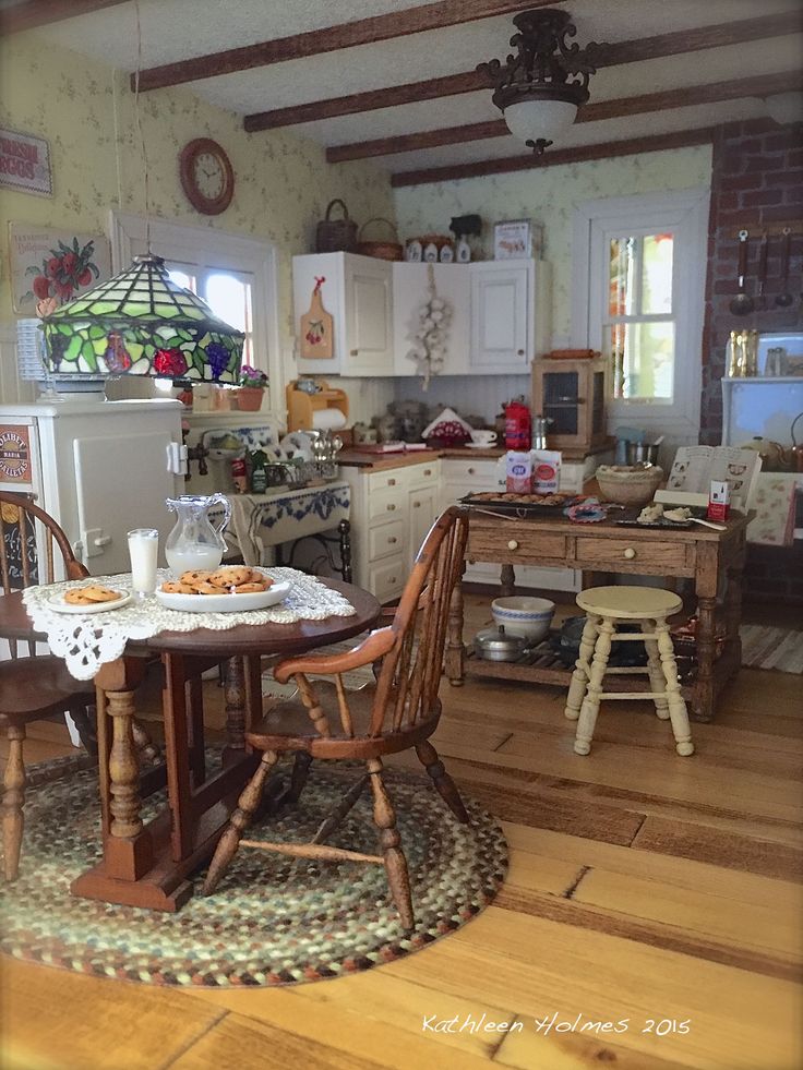 a kitchen filled with lots of wooden furniture and decor on top of a hard wood floor