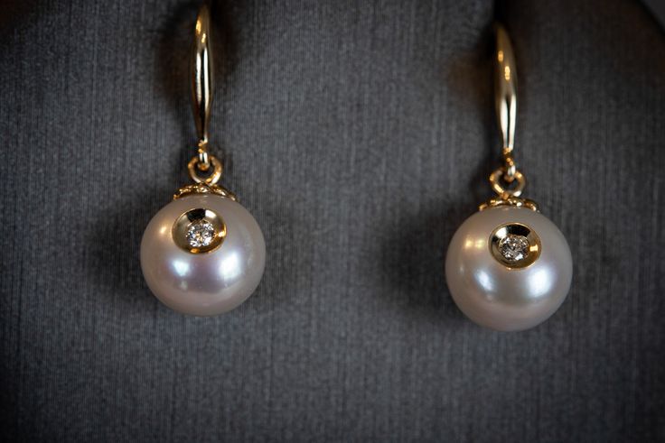 We are not talking about diamonds and pearls, we are talking about diamonds in pearls. A patented design of embedding a small diamond into a cultured pearl. This is a stunning new concept and an extremely special design for life's amazing events. Arriving just in time for Graduation, Mother's Day, Anniversary season and, of course, pearl month coming up in June! If you are looking for something incredibly special, you just found it! Designed by the Chi, the artist behind Galatea. We got to know this designer last month and begged him to let us carry these designs (and offer them at a discount to our amazing Pearl Girls!). We are so excited to offer the diamond in pearl designs. We have dangle earrings, stud earrings and pendants. Buy a set and save! Available in 14k yellow gold but we can Diamond Pearl Drop Earrings As Gift, Diamond Earrings With Pearl Drop For Gift, Diamond Earrings With Pearl Drop As Gift, Gift Diamond Earrings With Pearl Drop, Pearl Drop Diamond Earrings For Anniversary, Timeless Pearl Earrings With Diamond Accents, Akoya Pearl Diamond Earrings With Diamond Accents For Evening, Timeless Pearl Earrings With Diamond Accents As Gift, Elegant Teardrop Single Diamond Jewelry