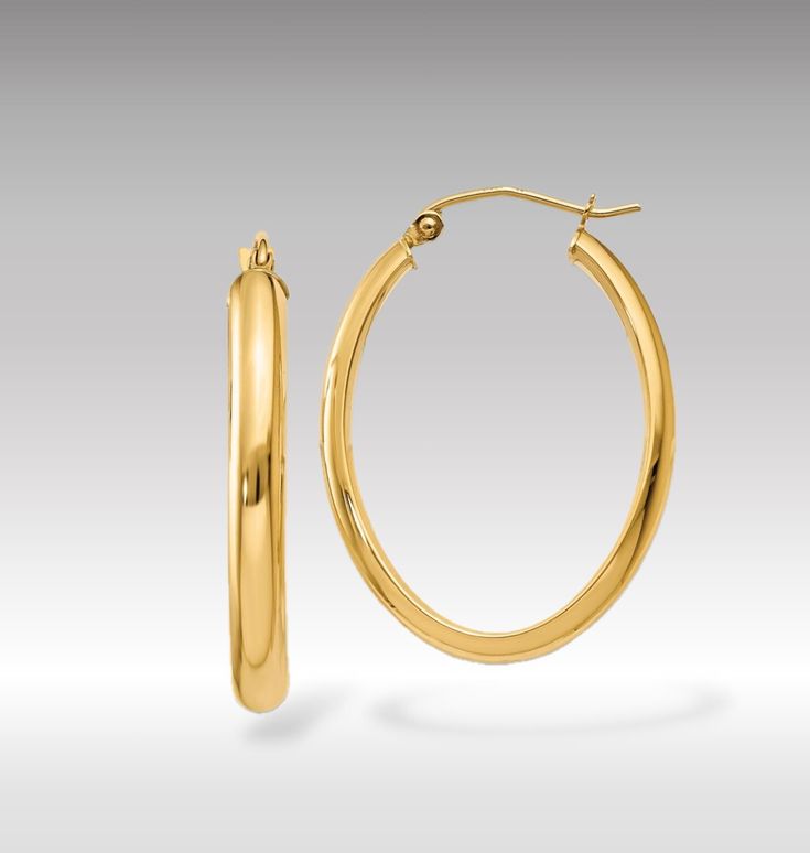 Introducing our 14K Yellow Gold Polished 3.5mm Thick Slim Oval Hoop Earrings, a quintessential piece that marries the timeless elegance of classic hoop earrings with the modern appeal of a minimalist design. These exquisite earrings are crafted from premium 14K yellow gold, polished to a radiant sheen that enhances their sleek and slim profile. The oval shape offers a contemporary twist on the traditional round hoop, providing a flattering elongated look that accentuates the jawline and cheekbones. At 3.5mm thick, these hoops strike the perfect balance between delicate and noticeable, making them versatile enough for both day-to-day wear and special occasions. These hoop earrings are designed for those who appreciate the beauty of simplicity in their jewelry. Their polished finish catches Minimalist Oval Hoop Earrings For Anniversary, Minimalist Oval Hoop Earrings Tarnish Resistant, Minimalist Oval Tarnish Resistant Hoop Earrings, Minimalist Oval Tarnish-resistant Hoop Earrings, Minimalist Tarnish-resistant Oval Hoop Earrings, Classic Tarnish-resistant Oval Hoop Earrings, Everyday Tarnish-resistant Oval Hoop Earrings, Oval Hoop Earrings, Earrings Classic