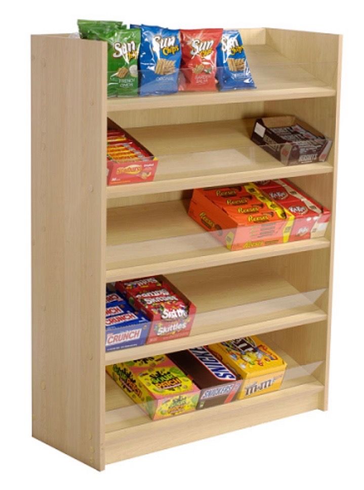 a wooden shelf filled with lots of snacks