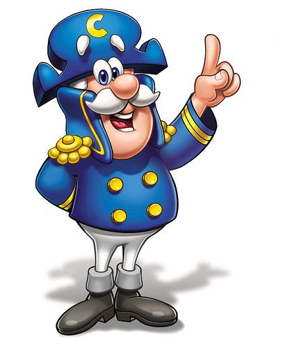 a cartoon character in blue and yellow clothes giving the peace sign with his hand while standing on one foot