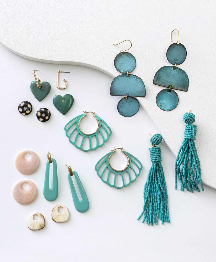 This sea-inspired statement made of hand carved horn is sure to give you that beach-chic look. Trendy Shell-shaped Jewelry Gift, Elegant Green Jewelry For Beach, Elegant Green Jewelry For The Beach, Elegant Green Beach Jewelry, Turquoise Resin Drop Earrings, Unique Beach Drop Earrings, Unique Beach Style Drop Earrings, Blue Resin Jewelry For Summer, Handmade Beachy Dangle Jewelry