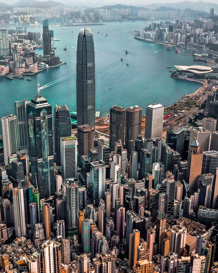 an aerial view of a large city with lots of tall buildings in the foreground