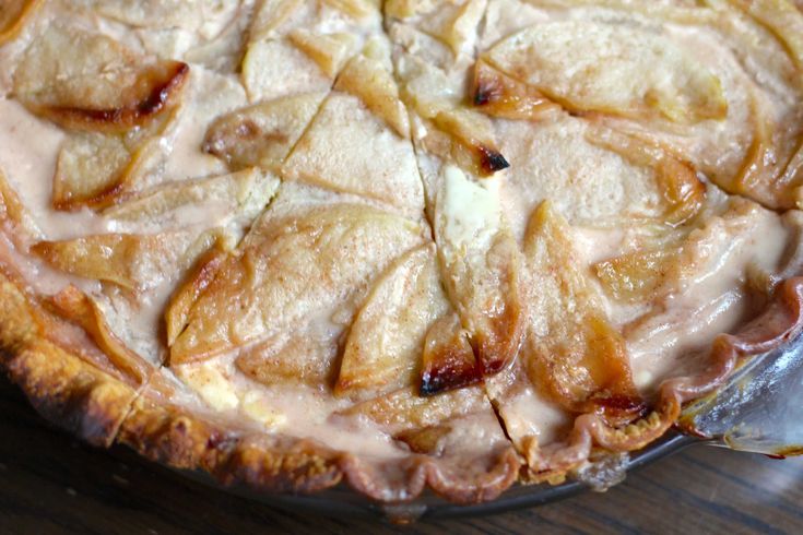 an apple pie is sitting on a table