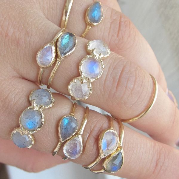 Compass Ring Stackable Moonstone Diamond Ring As Gift, Spiritual Gemstone Rings For Anniversary, Oval Gemstone Stackable Rings For Promise, Oval Gemstone Stackable Promise Rings, Stackable Open Opal Ring In Fine Jewelry Style, Heirloom Oval Stackable Jewelry, Spiritual Stackable Moonstone Jewelry, Fine Jewelry Ring With Bezel Setting And Open Band, Spiritual Oval Stackable Rings