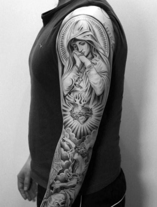 Roman Catholic Themed Guys Mother Mary Praying With Sacred Heart Sleeve Tattoo Religious Tattoo Sleeves, Angel Sleeve Tattoo, Mother Mary Tattoos, Lowrider Tattoo, Catholic Tattoos, Sacred Heart Tattoos, Mary Tattoo, Religious Tattoo, Jesus Tattoo