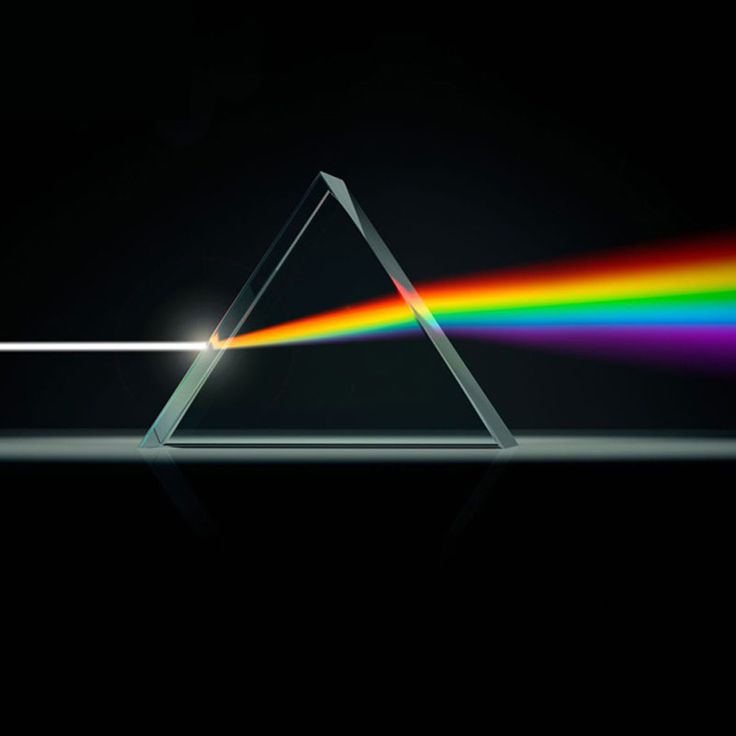 the dark side of the moon with a rainbow light coming from it