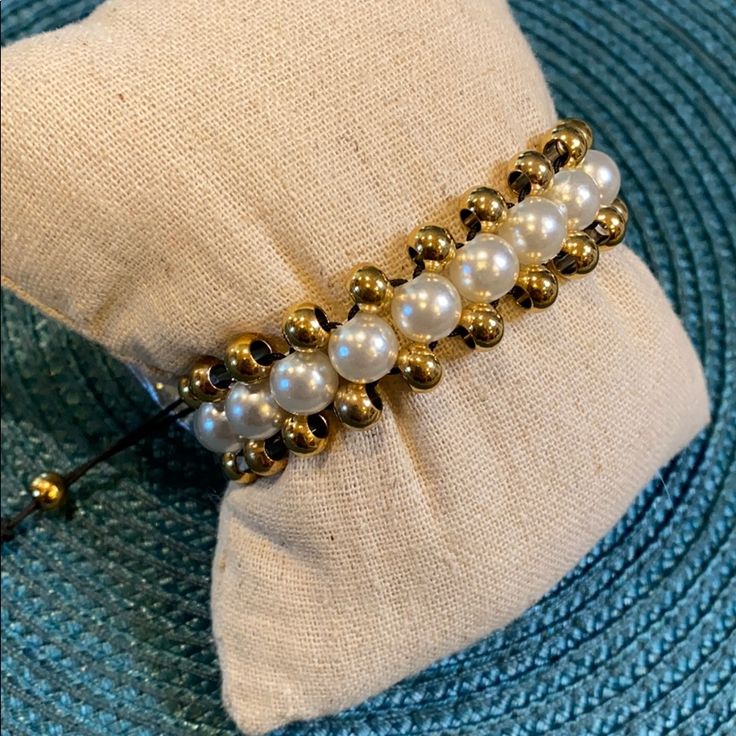 Gorgeous And Stunning Quality. White Pearl And Gold Bead Braided Bracelet With Black Draw Pull Closure. Perfect By Itself Or For Any Mixed Metal Arm Party. 10” Circumference Fully Extended. 7” Circumference At Its Tightest. Never Worn. Still In Original Packaging. Only Opened For Photos. Adjustable Pearl Bracelets With Round Beads, Adjustable Beaded Pearl Jewelry, Elegant Beaded Bracelets With Gold Beads For Beach, Adjustable Beaded Pearl Bracelet With Round Beads, Elegant White Beaded Bracelets With Sliding Knot, Elegant Adjustable Bracelets For Beach, Elegant Adjustable Beach Bracelets, Adjustable Pearl White Beaded Jewelry, Adjustable Pearl Bracelet With Gold Beads As A Gift