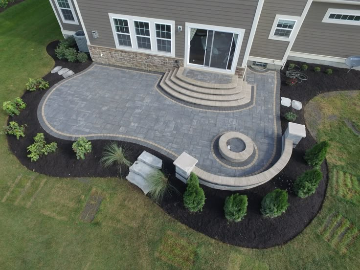 an aerial view of a house with landscaping