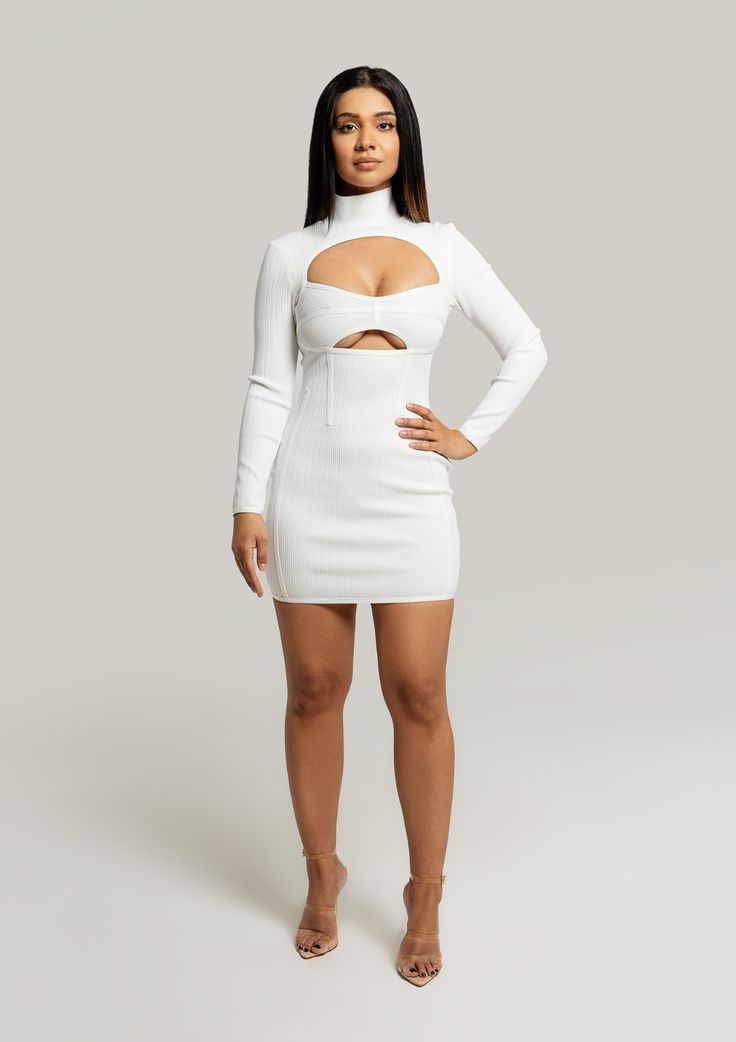 Natalia-Cut-Out-Long-Sleeve-Bodycon-Dress-White-Womens-Fashion-Trend|Vanity-Couture-Boutique Long Sleeve Cutout Bodycon Dress For Club, Long Sleeve Cutout Mini Dress For Club, White Fitted Long Sleeve Dress For Night Out, White Stretch Long Sleeve Bodycon Dress, Fitted White Cutout Bodycon Dress, White Long Sleeve Stretch Bodycon Dress, Bodycon Long Sleeve Dress With Thumbholes, White Fitted Cutout Bodycon Dress, Long Sleeve Bodycon Dress With Thumbholes