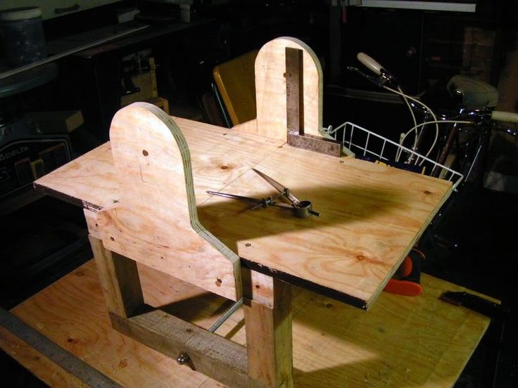 a wooden table that has some tools on it