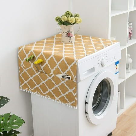 a white washer sitting next to a dryer in a room