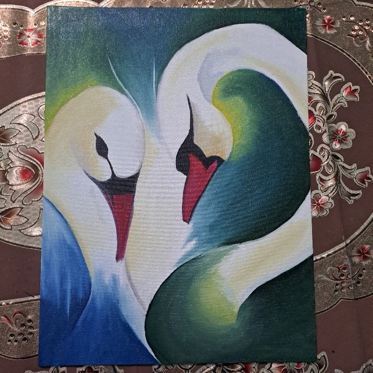 two white swans are touching each other on a piece of art with floral designs in the background