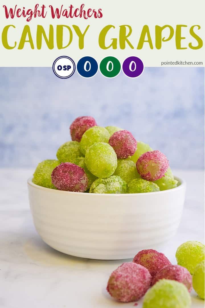 a white bowl filled with green and pink powdered sugar coated candies on top of a marble counter