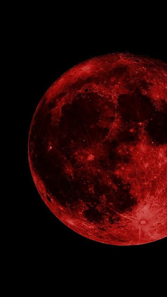 the full moon is shown in red and black