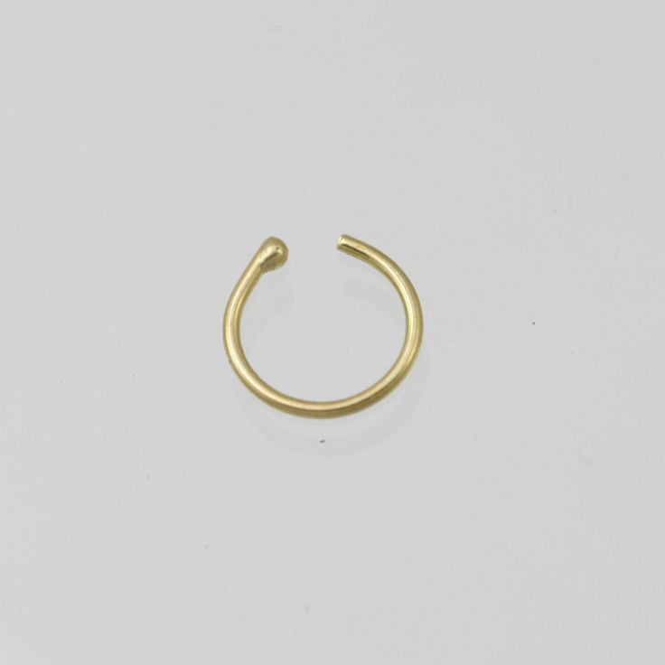 Handcrafted nose hoops in your choice of 14k yellow gold, rose gold, or white gold. (Solid Gold, not plated or filled). Hoop has a ball on one end to help secure in place. Measures about 9mm in diameter. 20 gauge Can be made with any gauge and diameter, feel free to request a price quote! Minimalist Stackable Septum Ring, Adjustable Minimalist Nose Rings For Everyday, Adjustable Minimalist Nose Rings, Minimalist Everyday Nose Rings, Everyday Minimalist Round Nose Rings, Nickel-free Minimalist Huggie Septum Ring, Minimalist Nickel-free Huggie Nose Rings, Adjustable Minimalist Huggie Septum Ring, Hypoallergenic Yellow Gold Nose Rings For Everyday