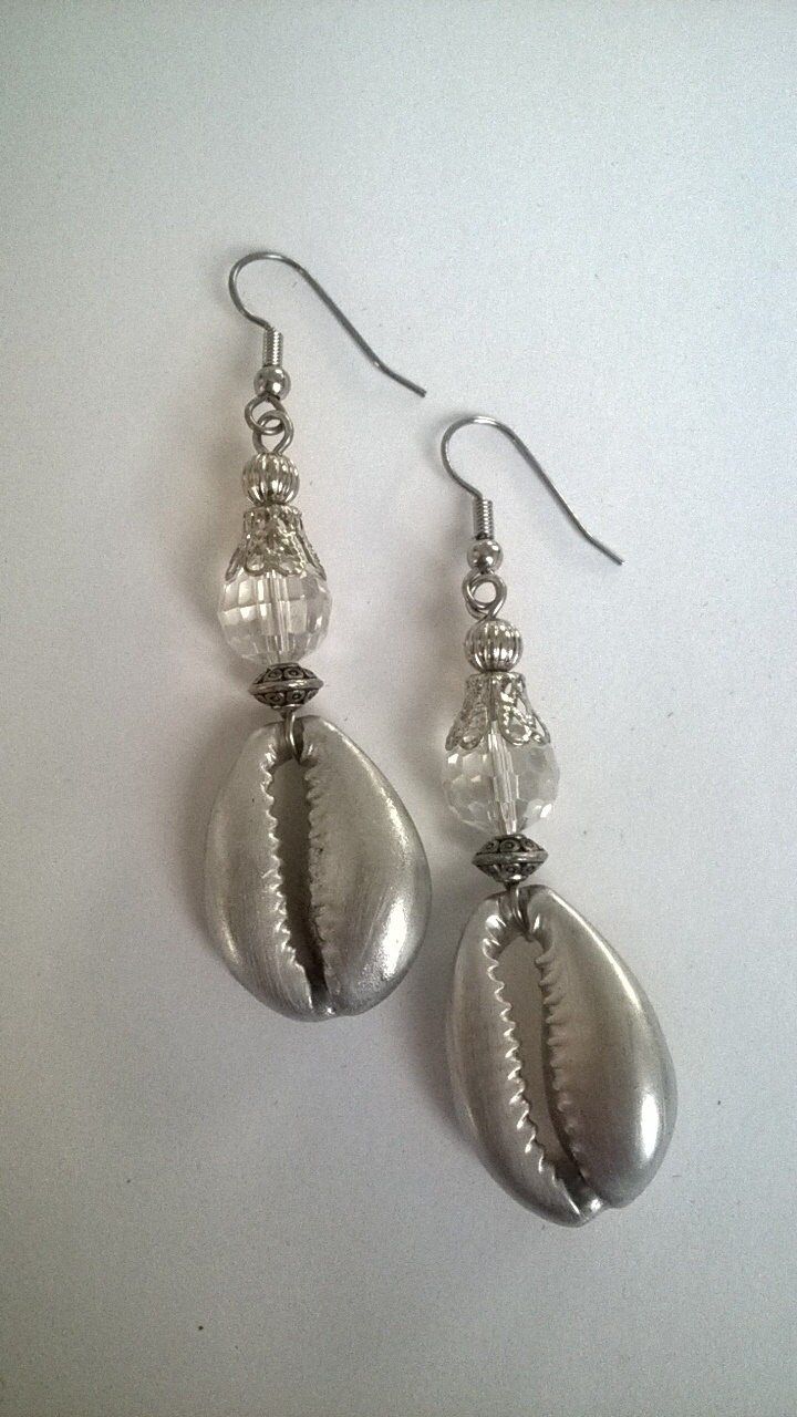 Classy Cowie Shell Earrings. A classy twist on a old favorite. Comes in Black, Sliver with Brass or Silver metal  accents. 2 inches long and can be converted to clip please note in order. Silver Teardrop Earrings For Beach, Nickel Free Silver Plug Earrings For Parties, Nickel-free Silver Plug Earrings For Parties, Silver Dangle Earrings For The Beach, Silver Teardrop Metal Clip-on Earrings, Handmade Silver Clip-on Earrings For Party, Silver Clip-on Earrings For Jewelry Making, Silver Dangle Clip-on Earrings With Ear Wire, Silver Bohemian Clip-on Earrings