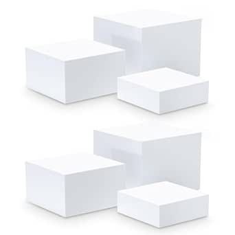 four white boxes are stacked on top of each other