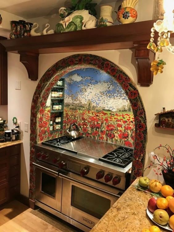 a kitchen with an oven, stove and fruit on the counter top in front of it