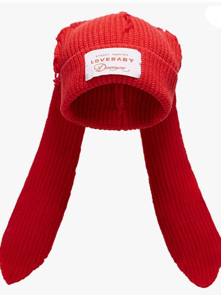 a red knitted hat with a white label on it's brimming