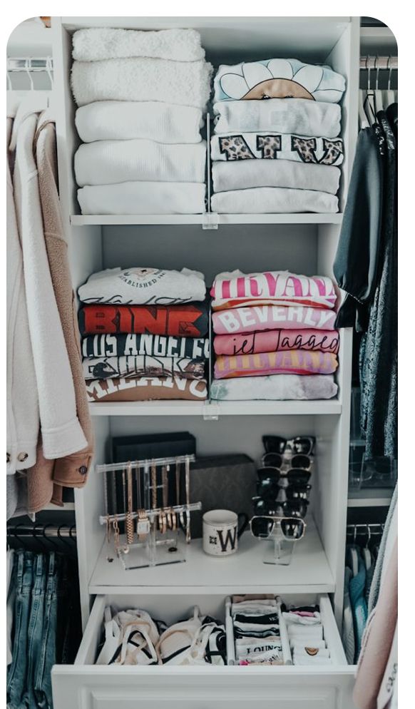 an organized closet with clothes and other items