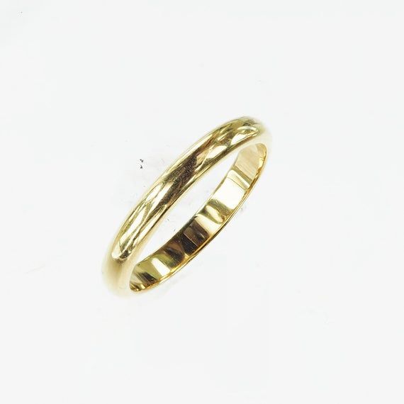 Vintage 1950's 14k yellow gold wedding band. The wedding band is a simple elegant gold wedding band. The band has the original "ArtCarved" trademark in script letters. This is a versatile and beautiful piece to add to a stackable ring set, by itself and as a wedding band. Other information: Size: 6Width: 1.8mm Height: 1.2mmSize: 7.5Width: 1.8mm Height: 1.2mm Classic 14k Gold Round Wedding Ring, Yellow Gold Engraved Ring Stamped 14k For Marriage, Classic Yellow Gold Engraved Ring, Classic Marriage Rings With Band Shape, Classic Wedding Band For Anniversary, Classic Formal Engraved Ring With Polished Edges, Classic Gold Engraved Ring, Classic Band Stackable Wedding Rings, Classic Engraved Ring With Polished Edges