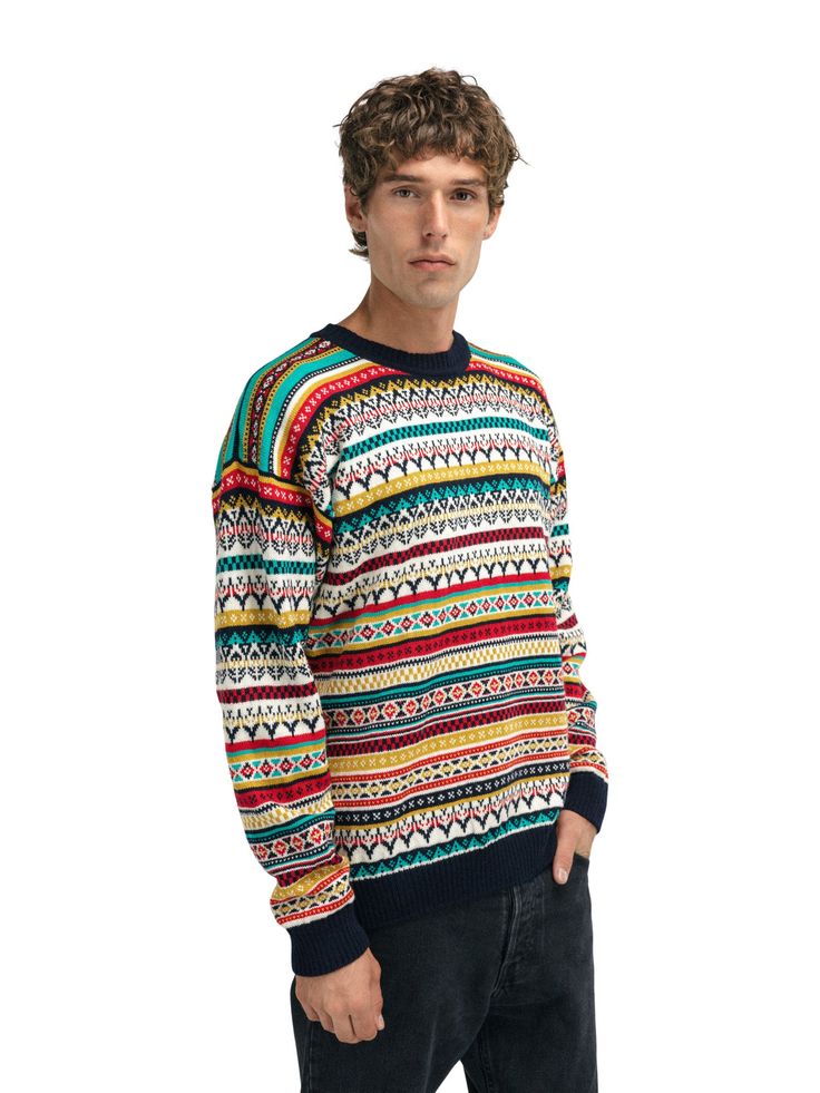 A playful, detailed and fully patterned wool sweater with a relaxed fit and round neck. The sweater is knitted in 100% long-lasting wool. The pattern is a mix of historical Dale patterns.

Fit: regular
Mid-layer
100% long-lasting wool
Round neck (crew neck)
Weight: 761g (size L)
Designed and knitted in Norway
Machine washable on a wool program
The model is 189 cm tall and is wearing a Large. Casual Wool Jacquard Knit Sweater, Casual Merino Wool Sweater With Fair Isle Pattern, Casual Merino Wool Jacquard Knit Sweater, Casual Wool Sweater With Fair Isle Pattern, Merino Wool Jacquard Knit Sweater With Crew Neck, Patterned Jacquard Knit Crew Neck Sweater, Scandinavian Style Jacquard Knit Sweater For Fall, Scandinavian Jacquard Knit Sweater For Fall, Patterned Knit Crew Neck Sweater