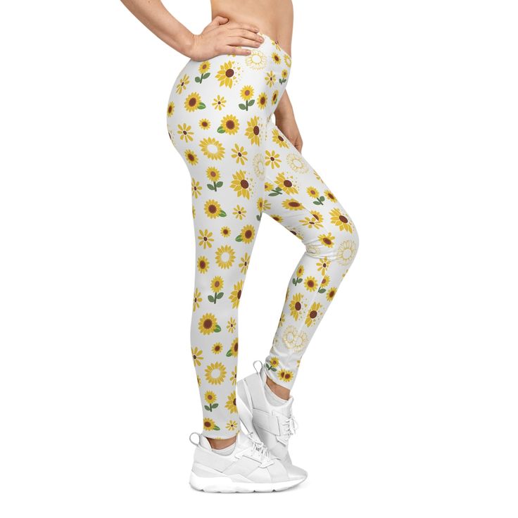 These are perfect for your summer workouts. The cute yellow sunflower and spring floral design will add a cheery touch to your exercise attire. Made with bright, breathable material, you'll feel comfortable and stylish all morning long. The most comfortable item in your clothing shop, these casual leggings are so smooth no one will ever want to step out of them. They're made from 83% polyester, 17% spandex and sport a silky finish. Perfect for chilling in the house and working out – the elastic waistband keeps them in place at all times. A size and care label is already attached. .: Material: 83% polyester, 17% spandex.: Seam thread color automatically matched to design (black or white).: Durable and stretchy fabric.: Runs true to size.: Size and care information printed inside the waistba Casual Summer Yoga Pants, Casual Yoga Pants For Summer Sports, Spring Leggings For Light Exercise, Stretch Leggings For Light Exercise In Spring, Fitted Workout Leggings For Summer, Spring Yoga Pants For Light Exercise, White Cotton Yoga Pants For Spring, Fitted Leggings For Light Exercise In Spring, Casual Summer Yoga Pants For Gym