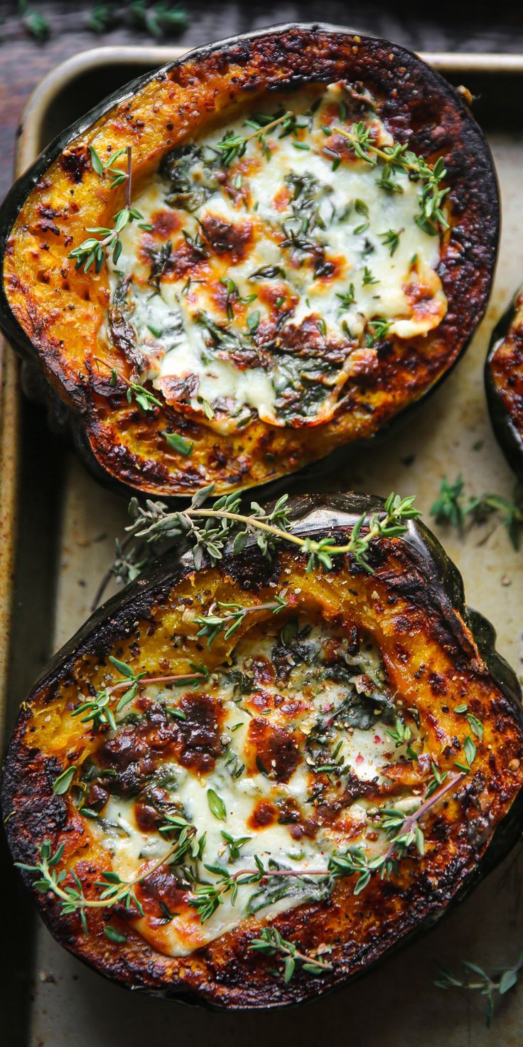 Stuffed Acorn Squash with Creamed Spinach on a baking sheet. Sliced Butternut Squash Recipes, Squash And Spinach Recipes, Butternut Squash Parmesan, Fall Stuffing Recipes, Autumn Dishes Recipes, Delish Keto Recipes, Butternut Squash And Acorn Squash Recipes, Baked Stuffed Squash, Acorn Recipes Squash