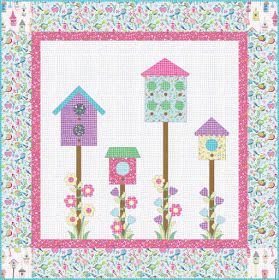 a quilted wall hanging with three bird houses and flowers on the outside, in front of a white background