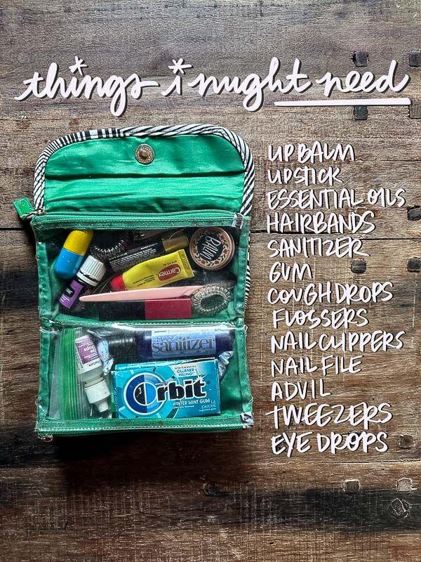 an open green bag with various items in it on top of a wooden table next to the words, things i might need