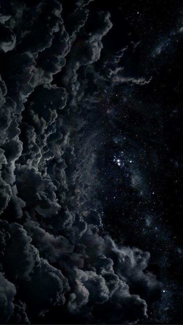 the night sky is filled with clouds and stars