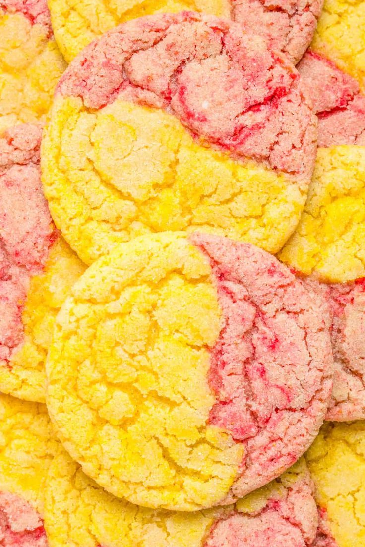 a pile of yellow and red cookies sitting on top of each other