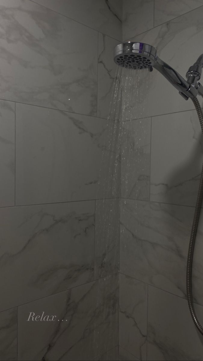 a shower head with water coming out of it