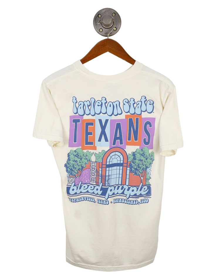 TSU Groovy Landmark Groovy Graphic Print Short Sleeve T-shirt, Purple Short Sleeve T-shirt For Fans, Fan Merchandise T-shirt For Spring, Spring Fan Merchandise Short Sleeve T-shirt, Fan Merchandise T-shirt With Front Print For Spring, Groovy Short Sleeve Top With Graphic Print, Groovy Graphic Print Top With Short Sleeves, Groovy White Short Sleeve Tops, Purple Short Sleeve Tops For Fan Merchandise