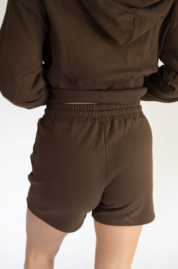 IDEAL FOR: Made from our customized high-quality cozy up fabric blend, these sweat shorts offer exceptional comfort, making them ideal for relaxed, everyday wear.Whether you're enjoying a lazy Sunday, running errands, or working from home, our Women's Sweat shorts are designed to keep you feeling relaxed and looking stylish. FEELS LIKE: The Coziest feeling ever! WHY WE LOVE THEM: Elevate your comfort and style with these sweat shorts, the perfect match for our Cozy Up Hoodie. EXTRAS: Crafted with your comfort in mind, these sweat shorts are designed to provide a cozy and stylish loungewear experience. Sporty Loungewear Shorts With Ribbed Waistband, Sporty Shorts With Ribbed Waistband For Loungewear, Comfy Leisure Shorts With Ribbed Waistband, Comfy Shorts With Ribbed Waistband For Leisure, Sporty Loungewear Shorts With Comfort Waistband, Brown Relaxed Fit Bottoms For Leisure, Casual Brown Athletic Shorts With Built-in Shorts, Relaxed Fit Shorts With Short Inseam For Leisure, Relaxed Fit Leisure Shorts With Short Inseam