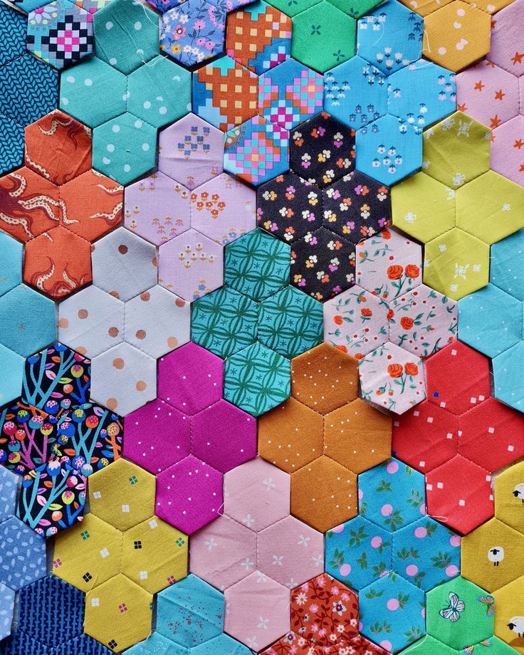 many different colored hexagons are arranged together