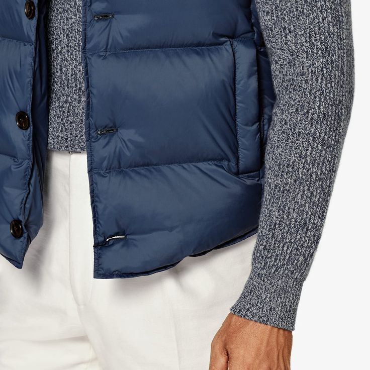 A lightweight layer that adds warmth and
  depth, this puffy mid-blue down vest is a versatile
  transitional piece that lends any look some
  dynamic volume. Blue Duck Down Outerwear For Fall, Blue Duck Down Puffer Jacket For Fall, Casual Blue Down Outerwear, Casual Down Puffer Vest, Blue Functional Outerwear For Work, Functional Blue Outerwear For Work, Blue Functional Puffer Jacket For Fall, Blue Nylon Puffer Jacket For Spring, Functional Blue Puffer Jacket For Fall