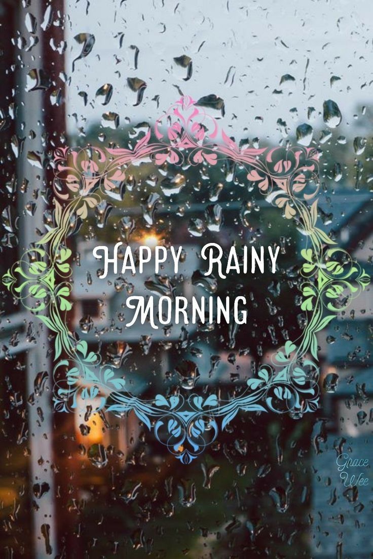 the words happy rainy morning are displayed through a window