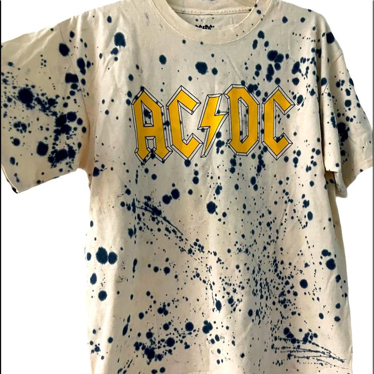 Ac/Dc Band Graphic Print Blue Paint Splatter All Over Print T-Shirt New Tags Ink Splatter - (Done By Manufacturer) Measurements: Taken On Flat Lay Across Pit2pit: 21” Length: 25” 100% Cotton Rt-2 Streetwear Cotton Tops With Paint Splatter, Casual Relaxed Fit Paint Splatter T-shirt, Relaxed Fit Cotton T-shirt With Paint Splatter, Cotton Paint Splatter Tops For Streetwear, Graphic Cotton T-shirt With Paint Splatter, Cotton Graphic Tee With Paint Splatter, Paint Splatter Graphic Tee In Cotton, Spring Crew Neck T-shirt With Paint Splatter, Cotton Crew Neck T-shirt With Paint Splatter