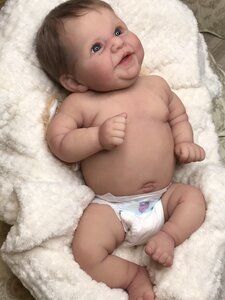 a baby laying on top of a blanket in the middle of it's diaper