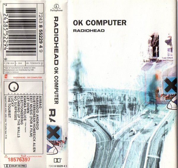 the back cover of a computer book with an image of a road and buildings on it