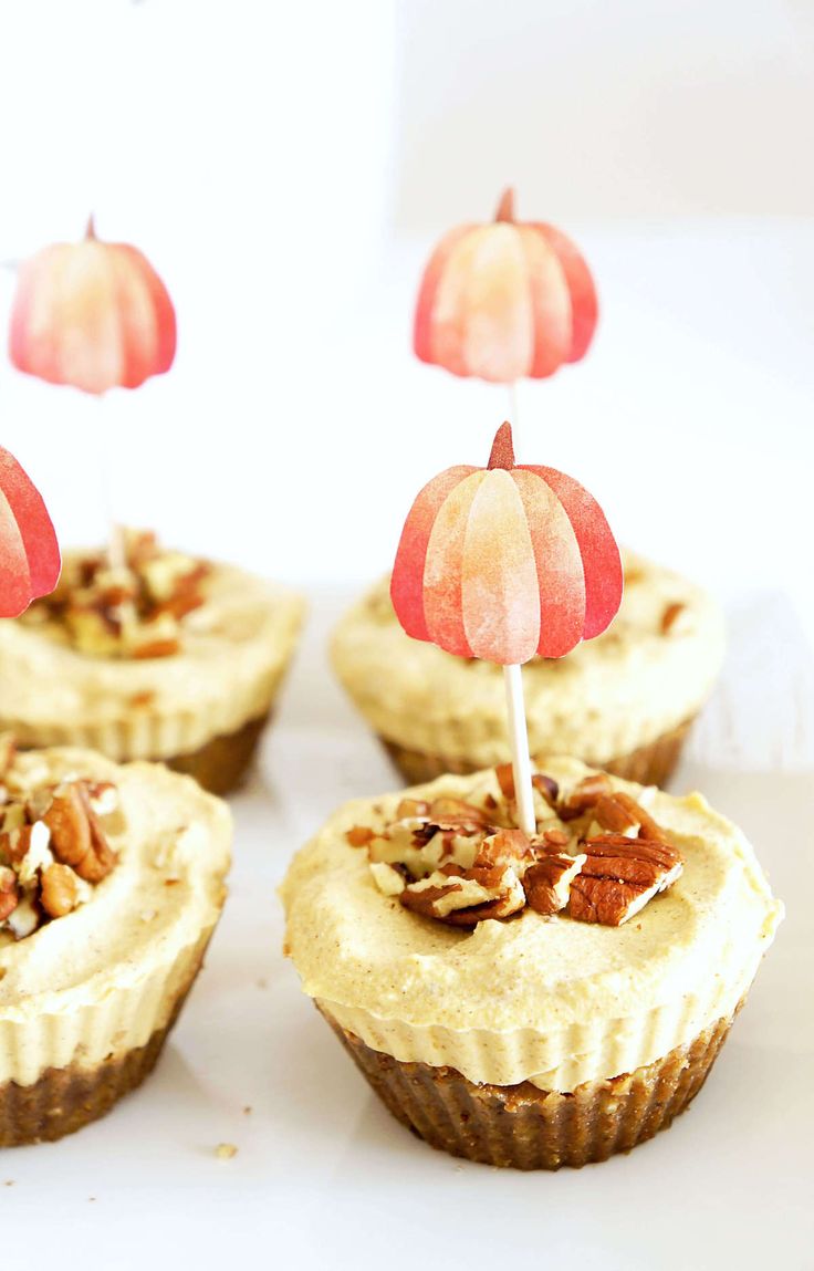 several cupcakes with decorations on top of them