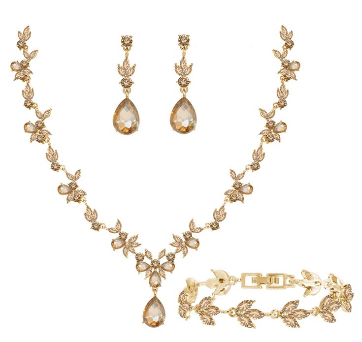 a necklace, bracelet and earring set with pear shaped stones in yellow gold tone