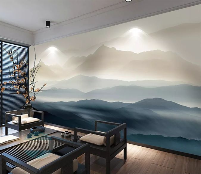 a living room with mountains painted on the wall