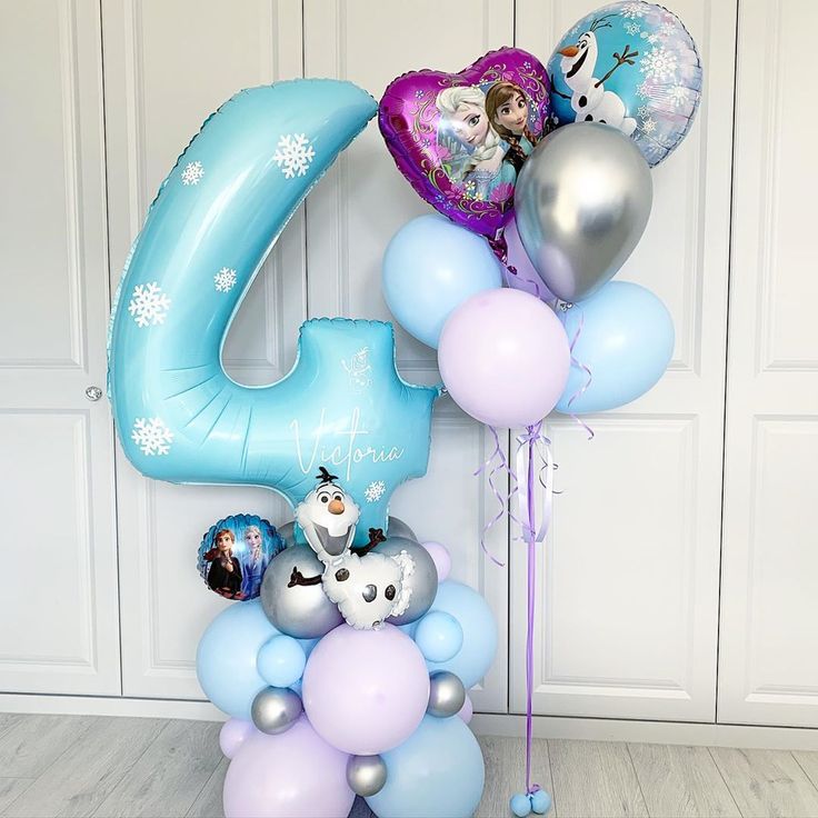 balloons and heliums are arranged in the shape of the number six for a frozen princess birthday party