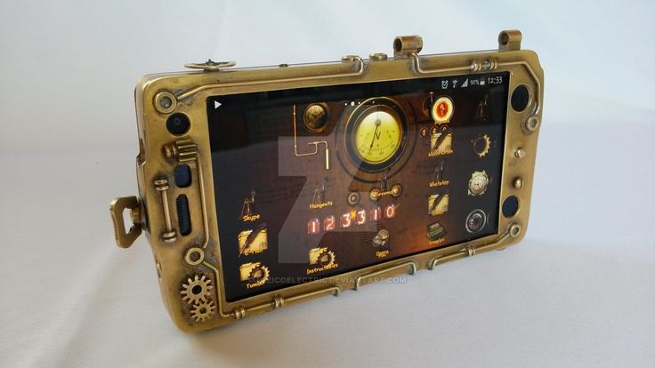 an old style cell phone is sitting on a white surface with steampunk and gears