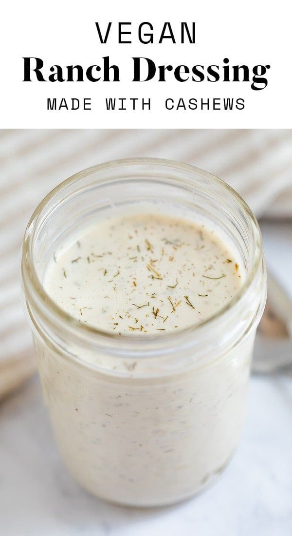 a jar filled with ranch dressing sitting on top of a table