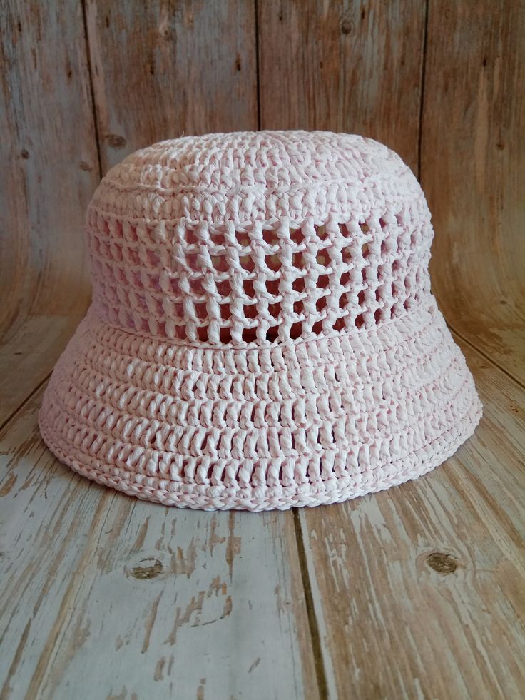 Women's hat crocheted from viscose raffia in pink color. Raffia is a natural, environmentally friendly, biodegradable and hygroscopic material. The hat is stylish, comfortable, transpirable, light and very durable, it will last more than one year. Perfect for the summer. The last row is reinforced. Dimensions: Head circumference 56-57 cm Hat brim 6,5 cm Care: Do not wash. Wipe it with a clean damp cloth. In case it is wrinkled or out of shape, you can steam it with an iron at medium temperature. Can be sent to you immediately after ordering. If you have any questions regarding this hat, feel free to ask. You can also find me on Instagram @liana.knitting.craft Spring Crochet Straw Hat, Spring Crochet Straw Hat Made Of Yarn, Handmade Straw Cap Hat For Spring, Handmade Spring Straw Cap Hat, Handmade Spring Straw Cap, Lightweight Yarn Sun Hat, One Size, Lightweight Yarn Sun Hat, One Size Fits Most, Lightweight Spring Crochet Cap, Knitted Cotton Yarn Sun Hat For Spring