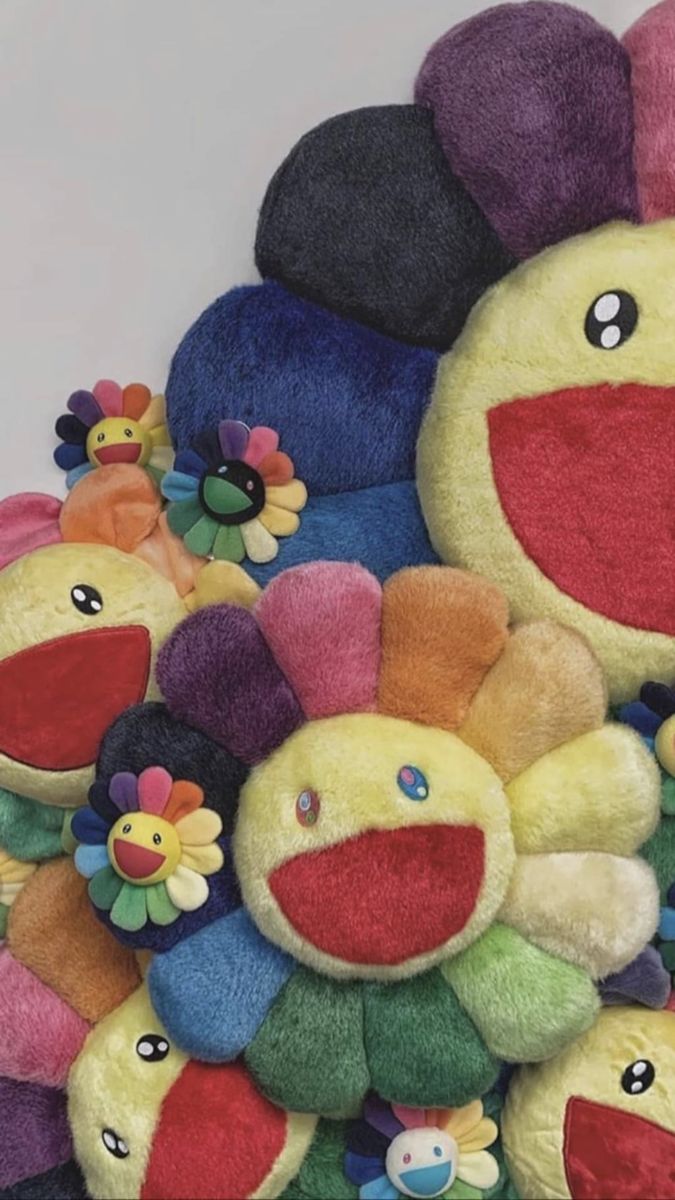 a pile of stuffed animals sitting next to each other